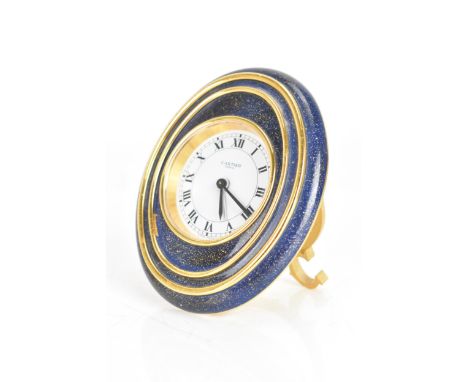 A Cartier Lapis Lazuli Vendome travel alarm clock, having a white enamel with black Roman numerals, easel back, blue sapphire