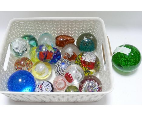 A collection of glass paperweight to include caithness examples 