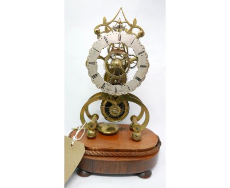 A 19th century brass skeleton clock, the dial marked 'Wales Leeds', raised on rosewood base, H.30cm 