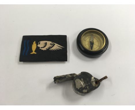An RAF interest Goldfish Escape/Resdue at sea patch, a rescue whistle marked AM and a compass