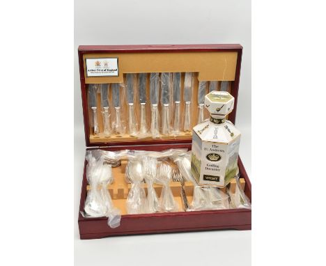 AN 'ARTHUR PRICE' CANTEEN AND A DECANTER, wooden canteen, EPNS cutlery, pieces individually wrapped, eight person table setti