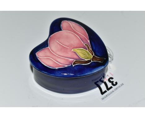 A MOORCROFT POTTERY 'MAGNOLIA' PATTERN TRINKET BOX, heart shaped box and cover, tube lined with a pink magnolia blossom on a 