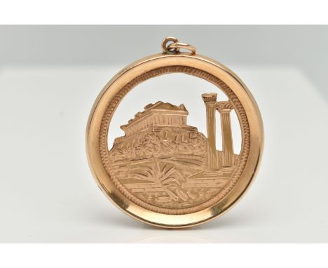 A LARGE YELLOW METAL PENDANT, of a circular form, depicting the Acropolis of Athens, approximate diameter 45.4mm, stamped to 