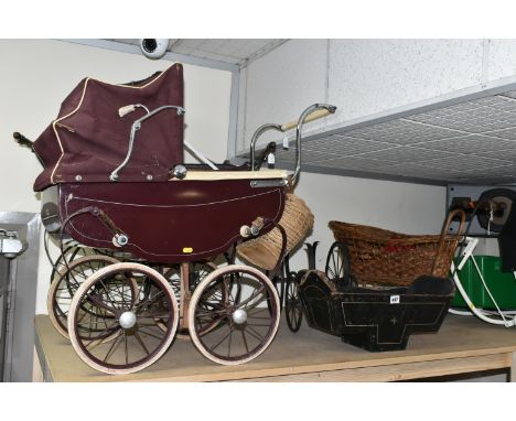 A LARGE QUANTITY OF EARLY TO MID CENTURY DOLL'S PRAMS, COTS AND ACCESSORIES, comprising a burgundy Triang pram with wicker ba