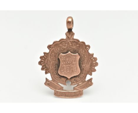 A LATE VICTORIAN 9CT GOLD FOB MEDAL, rose gold, wavy floral shape with a central engraved shield cartouche, with vacant swag 