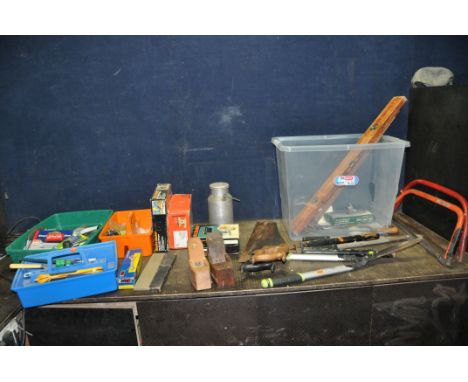 A PLASTIC BOX AND TWO TRAYS CONTAINING TOOLS including two vintage saws, two spirit levels, two bow saws, two coffin planes, 