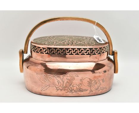 AN ORIENTAL COPPER AND BRASS HAND WARMER, engraved design to one side, pierced cover and fitted with a brass handle, approxim
