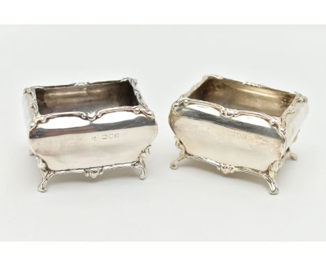 A PAIR OF GEORGE V SILVER SALTS, each of a rectangular form with swag detail to the rim, raised on four scroll feet, rubbed m