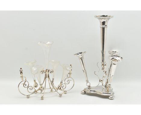 TWO SILVER PLATE EPERGNES, the first a four piece set, with four removeable tapering vases, the second a seven piece set, tog