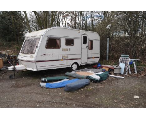 A 1994 ABBEY PIPER 14.5 EX 5 BERTH TOURING CARAVAN with two sets of keys, fridge, sink, cooker, toilet, an Isabella awning, o