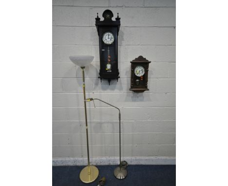A BRASS STANDARD LAMP, with frosted glass shade, another standard lamp, along with two wall clocks (condition report: general