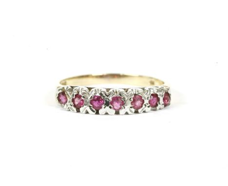 A 9ct gold round cut ruby half eternity ring, finger size N,1.68g