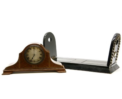 An Edwardian mahogany mantel clock, with French drum movement, 15cm, and an adjustable book rack