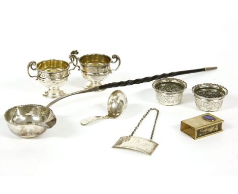 A quantity of various silver items to include a Georgian toddy ladle, a claret decanter label, two pairs of salts, etc