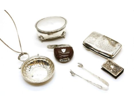 A collection of silver items, to include a tastevin by John Bull Ltd, Birmingham, l996, a pair of sugar tongs, cigarette case