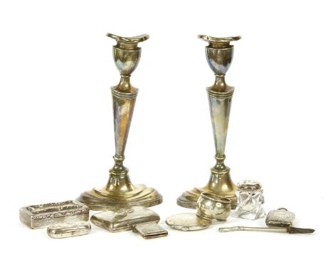 A pair of silver skinned candlesticks, together with a Victorian silver snuff box, a silver scent bottle, etc.