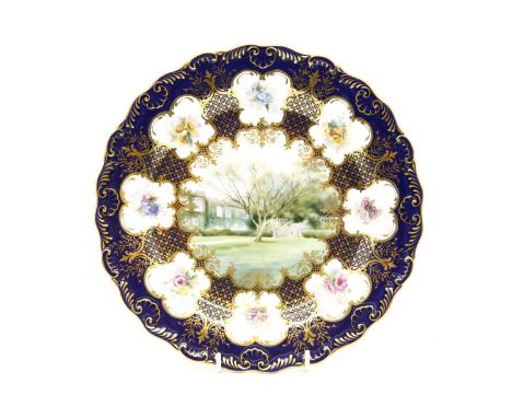 A Royal Worcester plate, painted with a scene of a castellated house, lawn and terrace, signed 'H. Davis', 22.5cm diameter, (