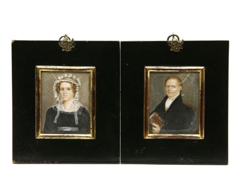 Pair of Georgian portrait miniatures in ebonised frames