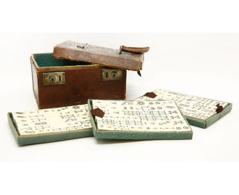 A vintage bone and bamboo Mah jong set, together with accessories and counters in a leather case