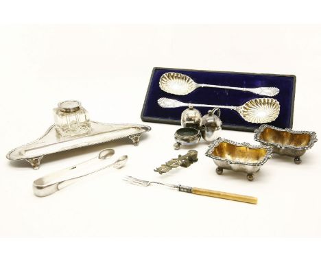 A silver inkwell/pen stand, together with a pair of plated salts, a pair of silver sugar tongs, and a pickle fork, etc. 5toz