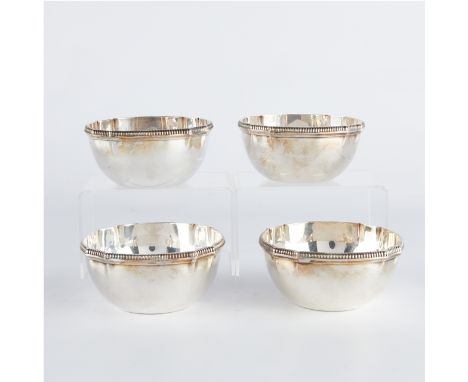 Kichigoro Uyeda, Japan. Group of four sterling silver bowls with decorative rims, marked "Sterling" and "K Uyeda" along the u