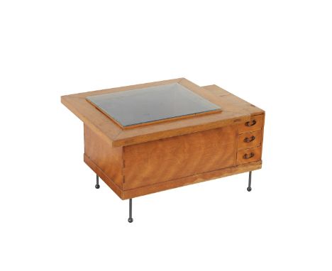 Japanese wooden hibachi with three drawers and an overhanging lip. The central basin has been fitted with a glass top, and th
