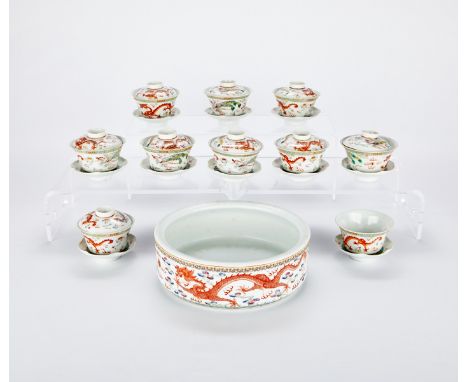 Set of ten Chinese small porcelain lidded bowls with saucers decorated with dragons and phoenixes. Each bowl marked with a si