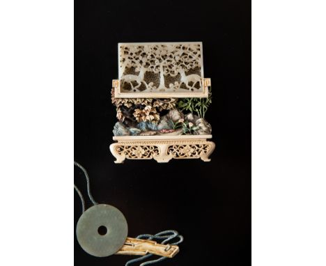 A striking pair of panels made in the 20th century of several earlier Chinese jade carvings. The largest of the jade carvings