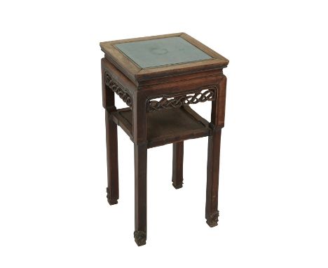 19th c. Chinese rosewood stand with one shelf and an inset panel along the top. With a carved skirt in an intricate interlaci