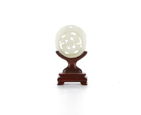 Chinese jade prayer wheel, with meticulous carved and pierced decoration on pale celadon jade. With a design of two animals c