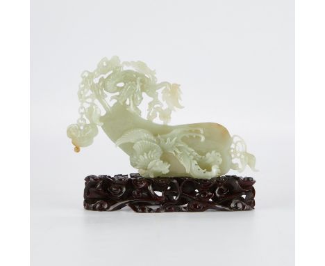 Chinese jade carving of a phoenix and dragon with a fan. Meticulously carved from a translucent celadon jade, with fine detai
