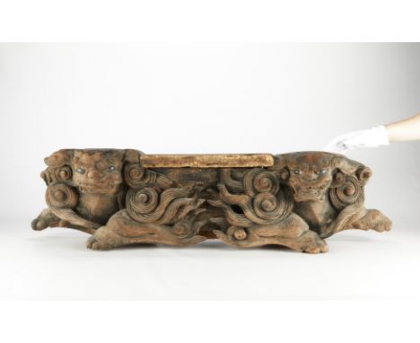 Japanese wooden lintel carving of a pair of foo dogs or shisas, likely an architectural fragment. With inset eyes and some re