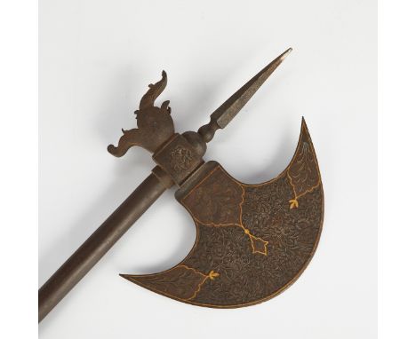 Persian iron and steel ax or axe, likely Qajar. With a crescent shaped blade and dragon's head motif terminal, the blade prof