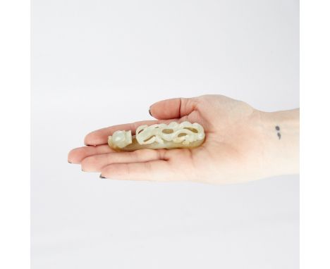 19th c. Chinese delicately carved celadon jade belt hook in the form of a dragon.Height: 1 in x width: 3 1/4 in x depth: 3/4 