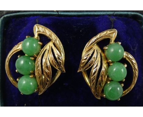 A pair of 14 ct gold and jade earclips, by J.A.W., of scroll form set with cabochon stones, case.