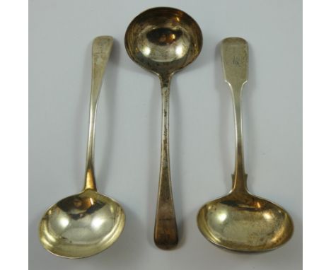 A George III silver pair of Old English pattern gravy ladles, London 1789, crested and a George III provincial silver fiddle 