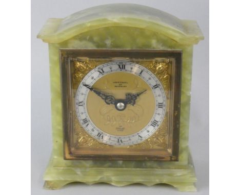 Elliott, retailed by Carmichael of Beverley, a green marble mantle clock, the gilt dial with silvered chapter ring, in an arc