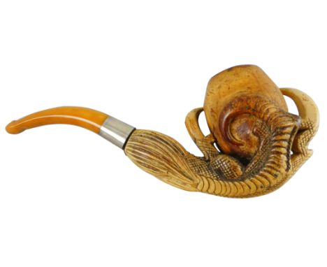 A Meerschaum pipe with amber stem, the bowl depicting a bird of prey's claw clutching an egg, 16 cm, cased.