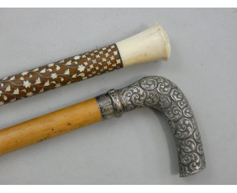 A 19ct century Anglo Indian walking cane, the hardwood stick inset with ivory lozenges, ivory surmount, length 102 cm togethe