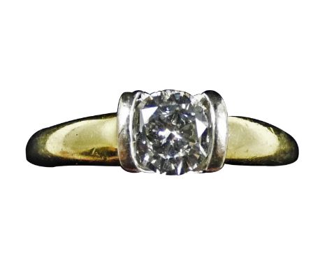 An 18ct gold single stone diamond ring, set with a brilliant cut diamond, stated weight 0.67 cts, colour estimate J/K, clarit