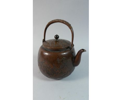 An 19th Century Oriental Copper Patinated Metal Teapot with Engraved Floral Decoration, 19cm High 