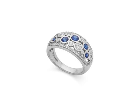  † An 18ct white gold sapphire and diamond dress ring  Collet-set with graduated round brilliant-cut diamonds and round-cut s