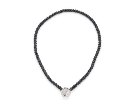  † Jörg Heinz: A 'Mystery Sphere' necklace  Composed of a strand of facetted black spinel beads, the clasp modelled as a whit