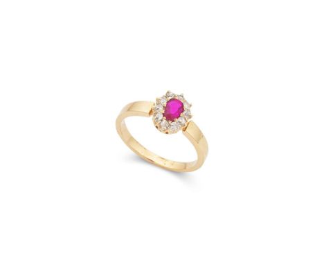  † A ruby and diamond cluster ring  Claw-set with an oval-cut ruby in a border of old round-cut diamonds, unmarked Ring size: