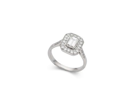  † A platinum diamond cluster ring  Collet-set with a cut-cornered rectangular-cut diamond, weighing approximately 0.90cts, i
