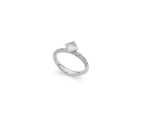  † A platinum diamond ring  Collet-set with a princess-cut diamond, the shoulders and setting with small round brilliant-cut 