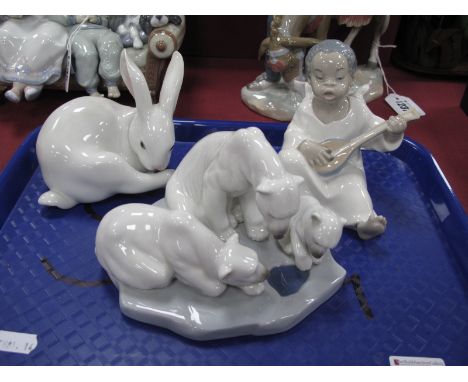 Three Lladro Figures - Cherub Playing Instrument, Polar Bear figure group, impressed No 1443 and a Rabbit, No 5906. (3)