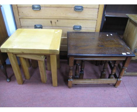 A Nest of Dark Oak Coffee Tables, two light wood tables.