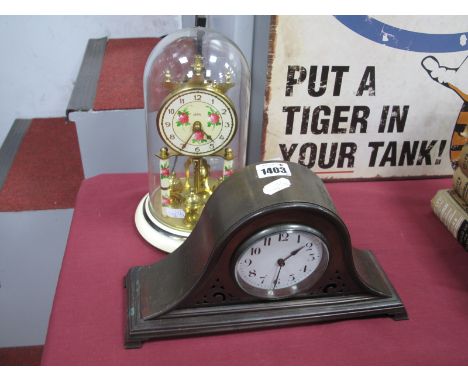 An Early XX Century Metal Cased Mantel Clock, Napoleon hat shape, with pierced decoration, white enamel dial with Arabic nume