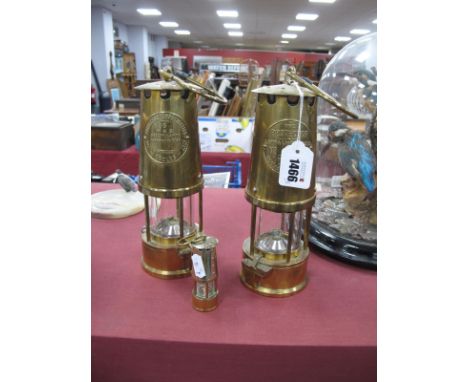 Eccles 'The Protector Lamp &amp; Lighting Co. Ltd No 6 Safety Lamp' Brass Miners Lamp; another by the same maker and a miniat